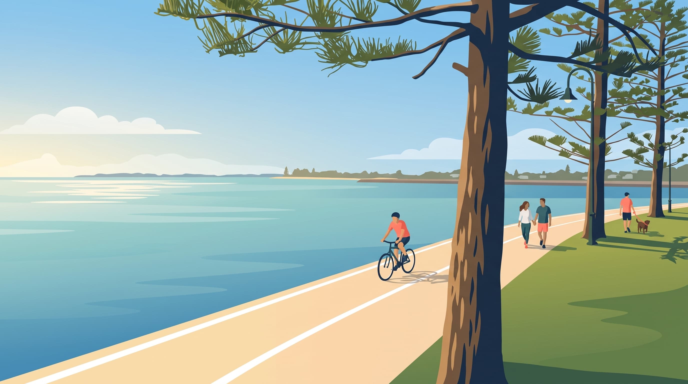 Walkers, a cyclist and a dog on the Wynnum foreshore path under Norfolk Island pine trees